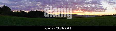 Sunset in the Sauerland. Landscape with setting sun in the evening. Stock Photo