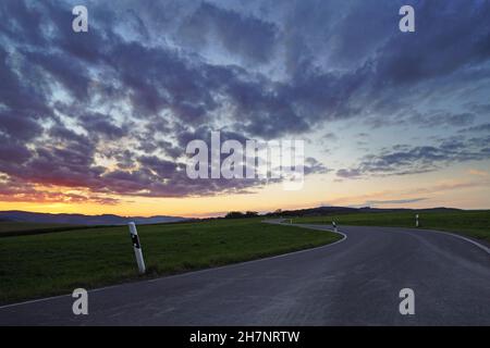Sunset in the Sauerland. Landscape with setting sun in the evening. Stock Photo