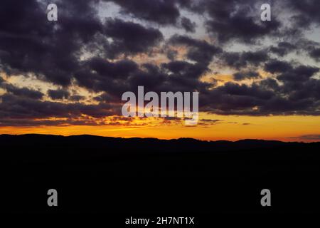 Sunset in the Sauerland. Landscape with setting sun in the evening. Stock Photo