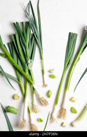 A bunch of fresh leeks on a white background. Stock Photo