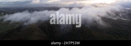 Low clouds drift across the rolling hills found east of San Francisco Bay, California. This scenic region turns green during the wet, winter months. Stock Photo