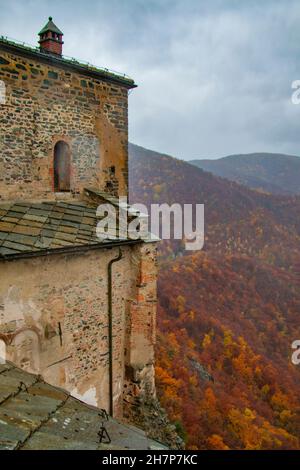 Fortified inaccesible exterior edifice of the Sacra di San Michele, Turin, Piedmonte, Italy - on Mount Pirchiriano, in the Italian Alps Stock Photo