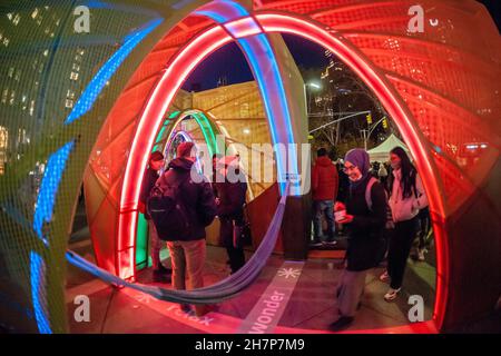 https://l450v.alamy.com/450v/2h7p7m9/visitors-to-flatiron-plaza-in-new-york-on-monday-november-22-2021-interact-with-interwoven-created-by-atelier-cho-thompson-the-christmas-installation-is-the-centerpiece-of-the-flatiron23rd-street-partnerships-holiday-programming-23-days-of-flatiron-cheer-interwoven-is-an-experiential-sculpture-with-lights-and-music-playing-when-visitors-pass-through-the-pieces-sensors-richard-b-levine-2h7p7m9.jpg