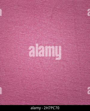 Winter pink simple fabric wool scarf pattern. Pink wool sweater texture. Stock Photo