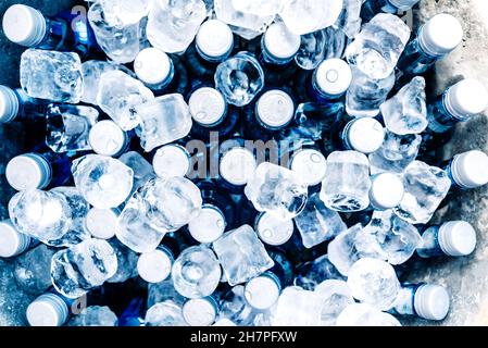 Valencia, Spain - November 23, 2021: Many plastic water bottles cooled with ice to keep them cool on hot days. Stock Photo