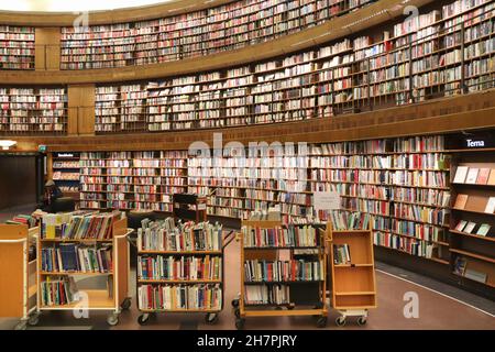 STOCKHOLM, SWEDEN - AUGUST 22, 2018: People visit the rounded building of Stockholm Public Library (Stadsbiblioteket). The library was opened in 1928. Stock Photo