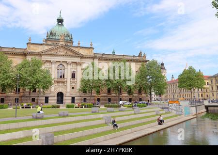 LEIPZIG, GERMANY - MAY 9, 2018: People sit in city park by Federal Administrative Court (Bundesverwaltungsgericht) in Leipzig, Germany. It is one of f Stock Photo