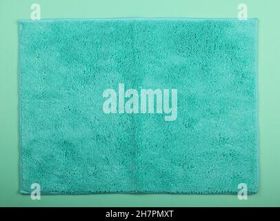 Close up teal blue microfiber washcloth, household cleaning wipe or towel background texture Stock Photo