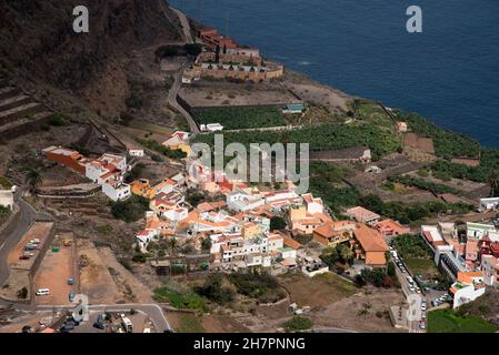 Agulo is a tiny town situated 250 meters above sea level under very steep volcanic slopes at the north coast of La Gomera in the Canary Islands Stock Photo