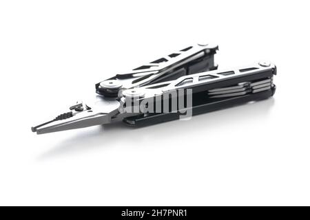 Multi-tools pliers with other tools and knife. Multifunction pliers isolated on white background. Stock Photo