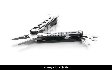 Multi-tools pliers with other tools and knife. Multifunction pliers isolated on white background. Stock Photo