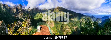 Breathtaking nature scenery of Madeira island, hiking in mountains. Popular tourist walk 'Vereda dos Balcoes' with stunning viewpoint Stock Photo