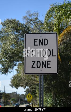 A sign says End School Zone. Stock Photo