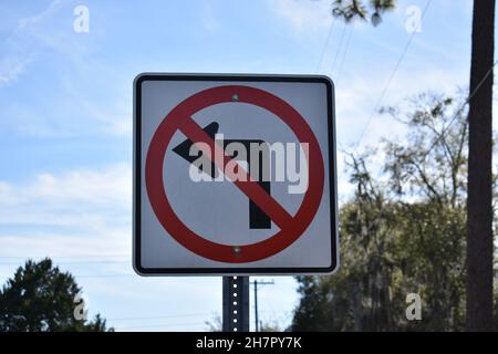 A sign symbolizes No Left Turn allowed. Stock Photo