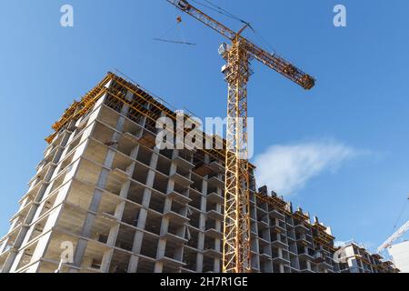 Residential building. Construction of a building using concrete construction technology. High brick residental building Stock Photo
