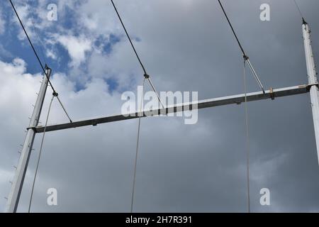 High power lines directly overhead connect to the grid. Stock Photo