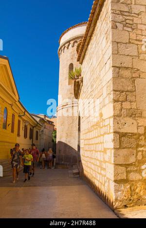 Krk, Croatia - Sept 2nd 2021. Tourists and locals walk past the Roman Catholic Diocese in Krk Town on Krk island in the Primorje-Gorski Kotar County Stock Photo