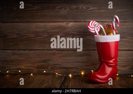 Santa boots with sweets and gifts for St. Nicholas Day on December 6th. Stock Photo