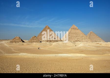 The Giza pyramid complex, also called the Giza Necropolis on the Giza Plateau in Egypt including the Great (Cheops) Pyramid of Giza, the Pyramid of Kh Stock Photo