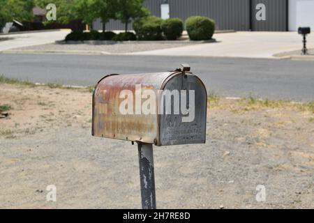 Close-up old rusty metal mailbox. Stock Photo
