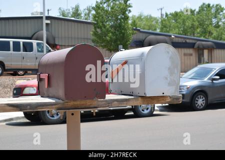 Back of standard brown and silver mailboxes. Stock Photo