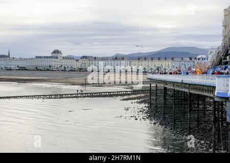 A view from the pier overlooking the grand sweep of Llandudno bay with typically pastel-painted hotels lining the promenade. Stock Photo