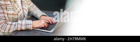 Woman hands with red manicure typing on laptop keyboard. Communication, workplace, business, education, freelance, internet, leisure time and technolo Stock Photo