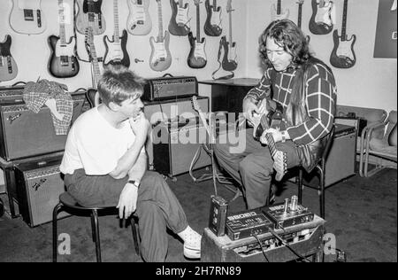 Irish blues/rock guitarist and singer Rory Gallagher trying out new equipment at Nomis Studios in West London, England on 11 July 1989. Stock Photo