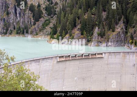 GIBIDUM DAM, NATERS, SWITZERLAND - September 27, 2020: Renewable energy. View on the hydro electric power dam in the mountains of Wallis. Stock Photo