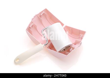 sticky roller cleaning, housework and housekeeping concept Stock Photo