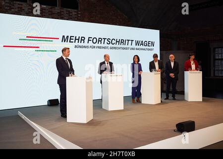 Berlin, Germany. 24th Nov, 2021. Leader of Germany's Free Democratic Party (FDP) Christian Lindner, Olaf Scholz of the Social Democratic Party (SPD), leaders of The Greens Annalena Baerbock and Robert Habeck, and leaders of SPD Norbert Walter-Borjans and Saskia Esken (from L to R) attend a joint press conference in Berlin, Germany, on Nov. 24, 2021. Coalition negotiations among Germany's Social Democratic Party (SPD), the Greens and the Free Democratic Party (FDP) ended as the three parties presented an agreement on Wednesday. Credit: Stefan Zeitz/Xinhua/Alamy Live News Stock Photo