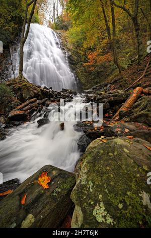 A vertical shot of a waterfall in the woods Stock Photo - Alamy