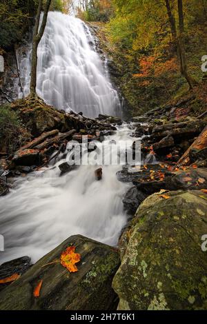A vertical shot of a waterfall in the woods Stock Photo - Alamy