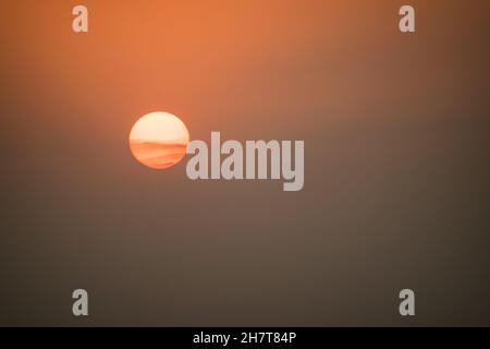 Beautiful sunset in the evening sky only with beautiful orange hues Stock Photo