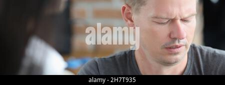 Male photographer is looking at camera screen with concentration Stock Photo