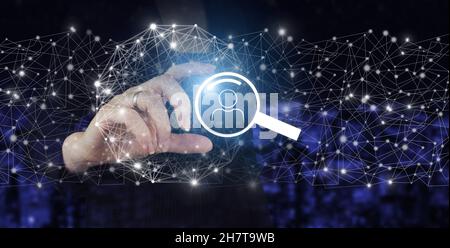 Searching Internet Data. Web Browsing Concept. Hand hold digital hologram search data sign on city dark blurred background. Searching Browsing Interne Stock Photo
