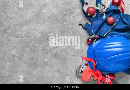 Set of construction tools and Christmas decor on grey background Stock Photo