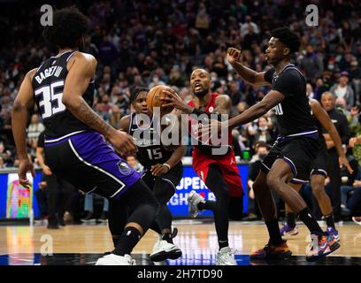 Sacramento, CA, USA. 24th Nov, 2021. Portland Trail Blazers guard Damian Lillard (0) is surrounded by Sacramento Kings forward Marvin Bagley III (35), Sacramento Kings guard Davion Mitchell (15) and Sacramento Kings center Damian Jones (30) during a game at the Golden 1 Center on Wednesday, November 24, 2021, in Sacramento. (Credit Image: © Paul Kitagaki Jr./ZUMA Press Wire) Stock Photo