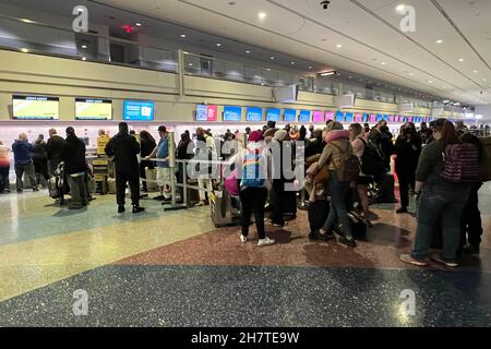 Passengers stand in line at the Spirit Airlines ticket and baggage check-in counter in Terminal 1 at McCarran International Airport aka Harry Reid Int Stock Photo