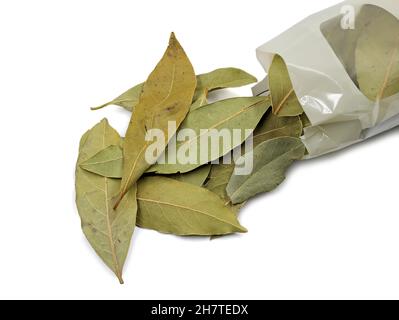 dried bay leaves with packaging isolated on white background Stock Photo