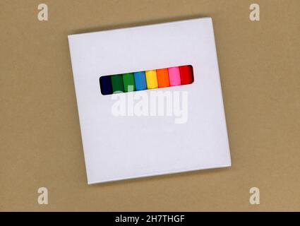 Colored pencils in a white cardboard box Stock Photo