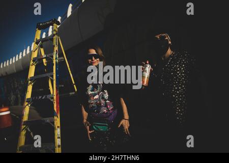 Lucy Aguirre and Violeta Silva, two visual artists who collaborate to paint the mural on the Luis Encinas boulevard bridge in Sonora by members of the Sangre del Desierto collectives with graffiti street art with images of the bighorn sheep, hummingbird, bees, tabachin and saguaros and the Sonora desert on November 24, 2021 in Sonora. (Photo by Luis Gutierrez / Norte Photo)  Lucy Aguirre y Violeta Silva dos artistas visuales que colaboran el pintar el mural en el puente bulevar Luis Encinas en Sonora por integrantes de los colectivos Sangre del Desierto con arte callejero del Grafiti con image Stock Photo