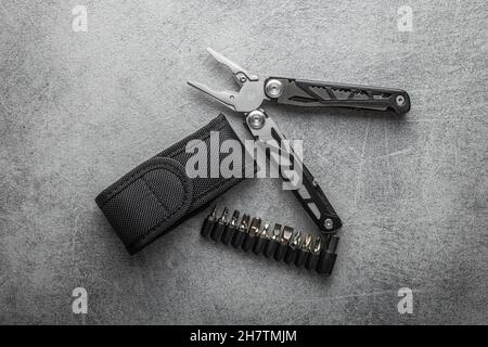 Multi-tools pliers with other tools and knife. Multifunction pliers. Stock Photo