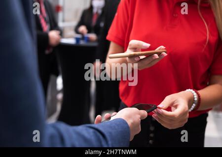 Event QR code ticket scanning before begining of business conference Stock Photo