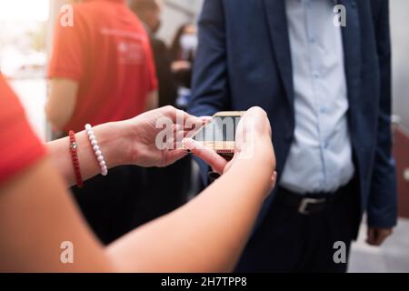 Event QR code ticket scanning before begining of business conference Stock Photo