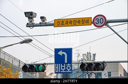 Traffic lights on the road with green traffic lights and speed limit signs. South Korea Stock Photo