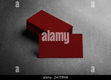 Blank dark red business card on grey background top view. Stock Photo