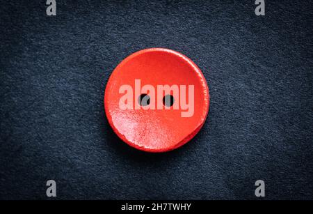 Red wooden sewing button Stock Photo