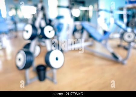 Abstract defocused gym background - Blurred bokeh of modern fitness studio club with natural light halos - Generic backdrop for healthy lifestyle Stock Photo