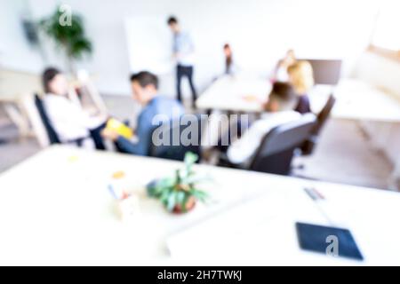 Blurred defocused background of businesspeople meeting with concentrated start up entrepreneur coworkers - Business concept with young people team Stock Photo